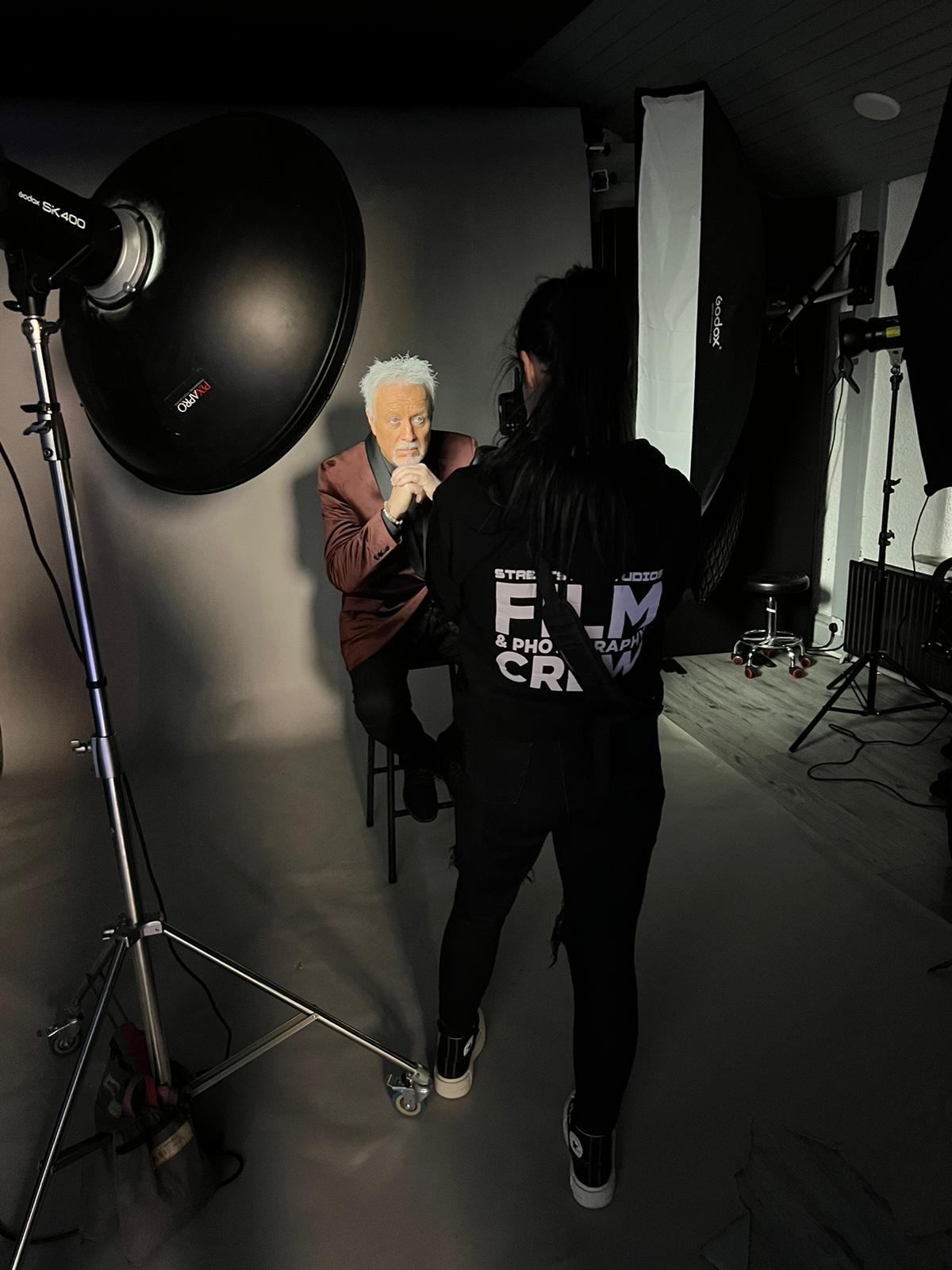 One of our photographers doing a photoshoot One of our photographers doing a photoshoot